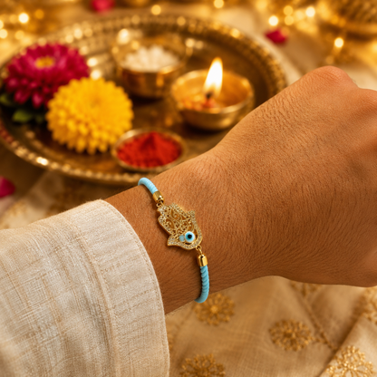 Sky Blue Hamsa Hand Evil Eye Rakhi with Gold Finish