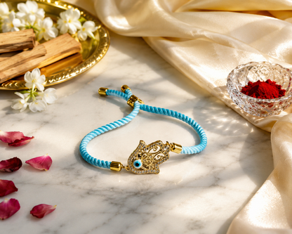 Sky Blue Hamsa Hand Evil Eye Rakhi with Gold Finish