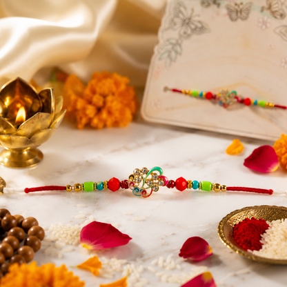 Handcrafted Multicolor Beaded Designer Rakhi with Red Thread